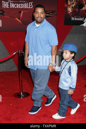 Actor Ice Cube, left, and his son, arrive as guests at the premiere of the new animated film from Pixar, 'The Incredibles' at the El Capitan Theatre in Los Angeles,  October 24, 2004. The film opens in the United States November 5th. (UPI Photo/Francis Specker) Stock Photo