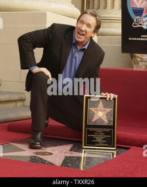 Actor Tim Allen holds a plaque after his star was unveiled on the Hollywood Walk of Fame during ceremonies along Hollywood Boulevard in Hollywood November 19, 2004. Allen, best known for his comedy television series 'Home Improvement' currently stars in the family comedy film 'Christmas with the Kranks.'   (UPI Photo/Jim Ruymen) Stock Photo