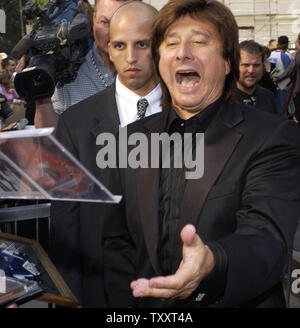 Steve Perry, former lead singer in the rock band Journey, signs autographs following an unveiling ceremony honnoring the group with the 2,275th star on the Hollywood Walk of Fame January 21, 2005. Over a 30-year period, Journey released 18 albums, selling 50 million copies on the strength of radio hits such as 'Don't Stop Believin',' 'Who's Crying Now,' and 'Open Arms.'    (UPI Photo/Lazlo Fitz) Stock Photo