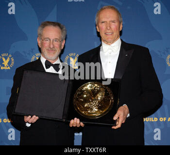 Actor and director Clint Eastwood (news), right, holds his award for outstanding directorial achievement in feature film for his work in 'Million Dollar Baby' with Steven Spielberg, who presented the award to Eastwood, at the 57th Annual Directors Guild Awards in Beverly Hills January 29, 2005.  (UPI PHOTO/JIM RUYMEN Stock Photo