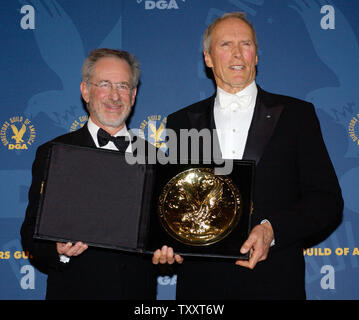 Actor and director Clint Eastwood (news), right, holds his award for outstanding directorial achievement in feature film for his work in 'Million Dollar Baby' with Steven Spielberg, who presented the award to Eastwood, at the 57th Annual Directors Guild Awards in Beverly Hills January 29, 2005.  (UPI PHOTO/JIM RUYMEN Stock Photo