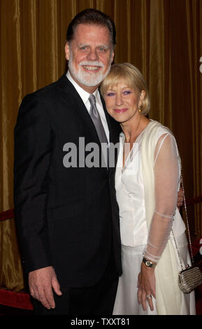 Director Taylor Hackford, nominated for outstanding directorial achievement in feature film for his work in 'Ray,' arrives with his wife, actress Helen Mirren at the 57th annual DGA awards in Beverly Hills, California Saturday, January 29, 2005.          (UPI Photo/Jim Ruymen) Stock Photo