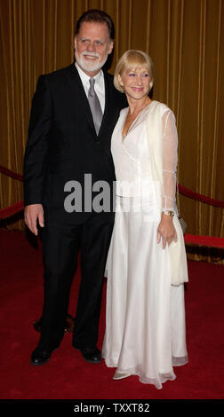 Director Taylor Hackford, nominated for outstanding directorial achievement in feature film for his work in 'Ray,' arrives with his wife, actress Helen Mirren at the 57th annual DGA awards in Beverly Hills, California Saturday, January 29, 2005.          (UPI Photo/Jim Ruymen) Stock Photo