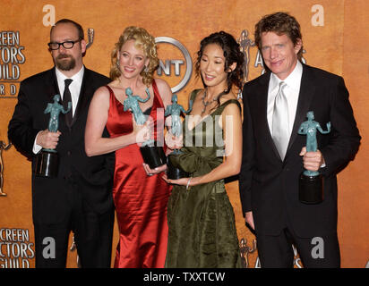 The cast of the film 'Sideways,' Paul Giamatti , Virginia Madsen, Sandra Oh and Thomas Hayden Church (L-R), hold the Actor awards they won for outstanding performance by an ensemble cast in a motion picture, during the 11th annual Screen Actors Guild Awards at the Shrine Auditorium in Los Angeles, California February 5, 2005.       (UPI Photo/Jim Ruymen) Stock Photo