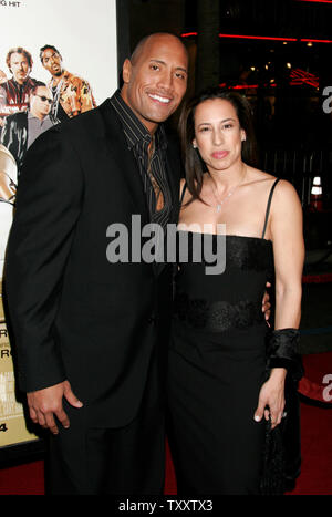 Actor Dwayne, The Rock, Johnson, left, and his wife, Dany Johnson, arrive at the February 14, 2005 Los Angeles premiere of the film, ' Be Cool', at Grauman's Chinese Theatre. (UPI Photo/Francis Specker) Stock Photo