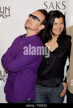 Bono (L), the lead singer for the rock band U2 and his wife Ali Hewson pose upon arriving for launch of new 'Conscious Commerce' clothing line EDUN in Beverly Hills, California March 25, 2005. EDUN is slated for a nationwide launch at 46 Saks Fifth Avenue stores across the U.S., making its debut in Beverly Hills.   (UPI Photo/Lazlo Fitz) Stock Photo