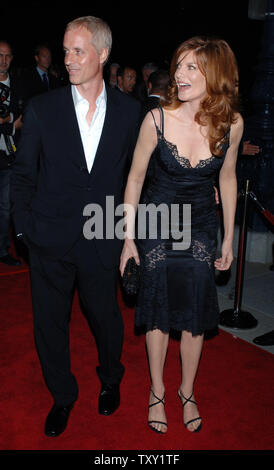 Actress Rene Russo (R), who stars in the motion picture crime drama 'Two for the Money' and her husband, writer Dan Gilroy, arrive for the premiere of the film at the Academy of Motion Picture Arts & Sciences in Beverly Hills, California September 26, 2005.   (UPI Photo/Jim Ruymen) Stock Photo