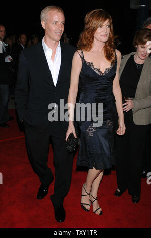 Actress Rene Russo (R), who stars in the motion picture crime drama 'Two for the Money' and her husband, writer Dan Gilroy, arrive for the premiere of the film at the Academy of Motion Picture Arts & Sciences in Beverly Hills, California September 26, 2005.  (UPI Photo/Jim Ruymen) Stock Photo