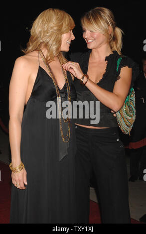 Cameron Diaz (R) and Toni Collette who co-star in the motion picture dramatic comedy 'In Her Shoes' share a moment during the premiere of the film at the Academy of Motion Pictures Arts and Sciences in Beverly Hills, California September 28, 2005. The movie, based on the novel by Jennifer Weiner, tells the story of party girl Maggie Feller, played by Diaz, and her head-on-straight sister Rose, played by Collette. The film opens in the U.S. on October 7, 2005.  (UPI Photo/Jim Ruymen) Stock Photo