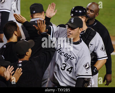 Chicago White Sox pitcher Freddy Garcia (R) celebrates with his teammates after an 8-2 win over the Los Angeles Angels in Game 4 of the American League championship series in Anaheim, California on October 15, 2005. Garcia pitched a complete game giving up 5 hits and 2 runs in a 8-2 Chicago win and a three games to one lead in the series. (UPI Photo/Jim Ruymen) Stock Photo