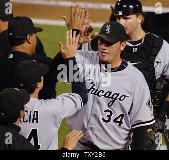 Chicago White Sox pitcher Freddy Garcia (R) celebrates with his teammates after an 8-2 win over the Los Angeles Angels in Game 4 of the American League championship series in Anaheim, California on October 15, 2005. Garcia pitched a complete game giving up 5 hits and 2 runs in a 8-2 Chicago win and a three games to one lead in the series. (UPI Photo/Jim Ruymen) Stock Photo