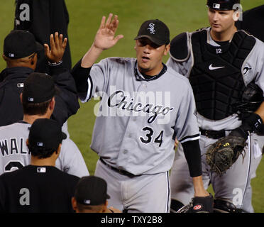 Chicago White Sox pitcher Freddy Garcia (C) celebrates with his teammates after an 8-2 win over the Los Angeles Angels in Game 4 of the American League championship series in Anaheim, California October 15, 2005. Garcia pitched a complete game giving up 5 hits and 2 runs in a 8-2 Chicago win and a three games to one lead in the series. (UPI Photo/Jim Ruymen) Stock Photo