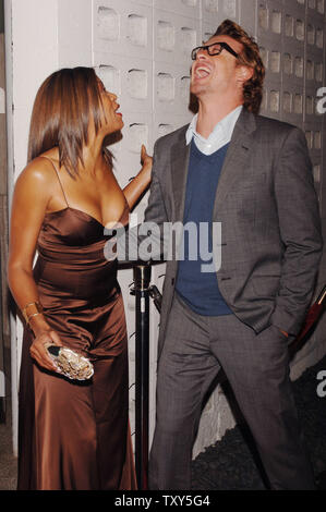 Australian actor Simon Baker (R), who stars in the dramatic comedy motion picture 'Something New', and fellow cast member Taraji P. Henson share a light moment during the premiere of the film at the Cinerama Dome in the Hollywood section of Los Angeles, California January 24, 2006.  (UPI Photo/Jim Ruymen) Stock Photo