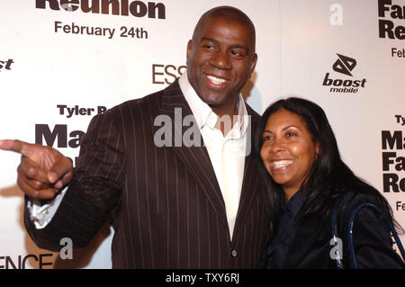 Earvin 'Magic' Johnson (L) and wife Cookie Johnson arrive for the premiere of Madea's Family Reunion at the ArcLight Cinemas  in Hollywood on February 21, 2006 . (UPI Photo/ Phil McCarten) Stock Photo