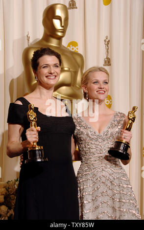 Reese Witherspoon (R) appears backstage with the Oscar she won for best ...