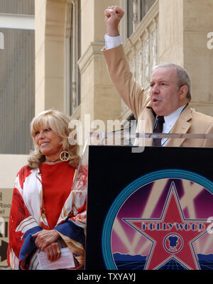 Frank Sinatra Jr. holds his fist in the air as he talks of a salute that is often given to his sister, Nancy Sinatra (L) during the unveiling ceremony honoring her with the 2,312th star on the Hollywood Walk of Fame in Los Angeles, California on May 11, 2006. (UPI Photo/Jim Ruymen) Stock Photo