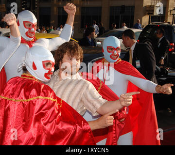 Cast member Jack Black is trailed by actors in Mexican lucha libre wrestling costumes during  the world premiere of the motion picture comedy 'Nacho Libre' at Grauman's Chinese Theatre in the Hollywood section of Los Angeles, California on June 12, 2006. The movie tells the story of Ignacio (Black), who is a cook by day in a Mexican orphanage and moonlights as a lucha libre wrestler to raise money for the orphans. The movie opens in the U.S. on June 16. (UPI Photo/Jim Ruymen) Stock Photo