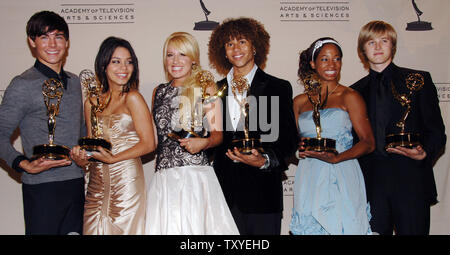 The cast of the Disney Channel film 'High School Musical' (L-R) Zac Efron, Vanessa Anne Hudgens, Ashely Tisdale, Corbin Bleu, Monique Coleman and Lucas Grabeel appear backstage with the Emmy awards the film won for outstanding children's program at the 2006 Creative Arts Emmy's in Los Angeles, California on August 19, 2006. (UPI Photo/Jim Ruymen) Stock Photo