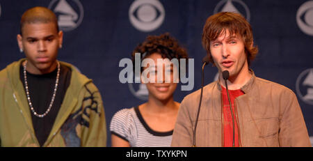 British singer James Blunt (R), who received five nominations announces nominees during the 49th Annual Grammy Awards nominations news conference in Los Angeles on December 7, 2006. Looking on are fellow presenters Chris Brown (L), who received a best new artist nomination and British singer Corinne Bailey Rae (C). The Grammys will take place in Los Angeles on Feb. 11, 2007. (UPI Photo/Jim Ruymen) Stock Photo