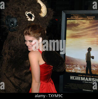 Kate Mara, a cast member in the motion picture sports drama 'We are Marshall', is greeted by the team mascot as she arrives for the premiere of the film at  Grauman's Chinese Theatre in the Hollywood section of Los Angeles on December 14, 2006. (UPI Photo/Jim Ruymen) Stock Photo