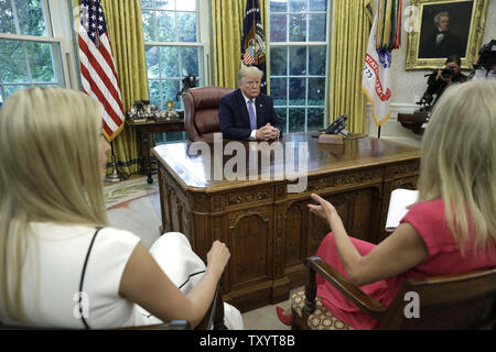 Washington, District of Columbia, USA. 25th June, 2019. US President Donald Trump listens to Counselor to the President Kellyanne Conway during a meeting on the the opioid epidemic in the Oval Office at the White House in Washington, DC, on June 25, 2019 Credit: Yuri Gripas/CNP/ZUMA Wire/Alamy Live News Stock Photo