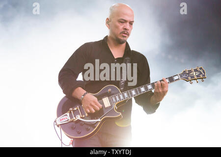 Joey Santiago from American grunge rock band The Pixies plays at Glastonbury Festival in 2014. Glastonbury Festival of Contemporary Performing Arts is the largest music festival in UK, attracting over 135,000 people each to Pilton, Somerset. Stock Photo