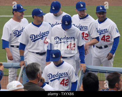 Los Angeles Dodgers return to the dugout prior to their game with