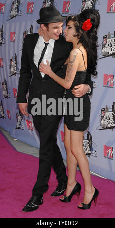 British singer Amy Winehouse arrives with her husband Blake Fiedler-Civil for the MTV Movie Awards in Los Angeles on June 3, 2007.  (UPI Photo/Jim Ruymen) Stock Photo