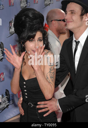 British singer Amy Winehouse arrives with her husband Blake Fiedler-Civil for the MTV Movie Awards in Los Angeles on June 3, 2007.  (UPI Photo/Jim Ruymen) Stock Photo