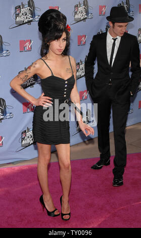 British singer Amy Winehouse arrives with her husband Blake Fiedler-Civil for the MTV Movie Awards in Los Angeles on June 3, 2007.  (UPI Photo/Jim Ruymen) Stock Photo