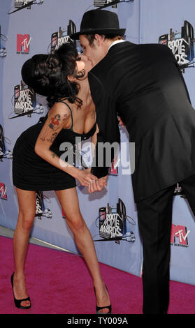 British singer Amy Winehouse arrives with her husband Blake Fiedler-Civil for the MTV Movie Awards in Los Angeles on June 3, 2007.  (UPI Photo/Jim Ruymen) Stock Photo