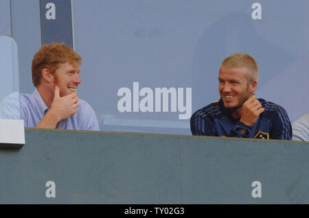 Los Angeles Galaxy President and General Manager Alexi Lalas (L) sits with Los Angeles Galaxy's David Beckham (R) in a luxury box as the Galaxy plays the Tigres UANL of Mexico, during their World Series of Football soccer match in Carson, California on July 17, 2007.  (UPI Photo/Jim Ruymen) Stock Photo