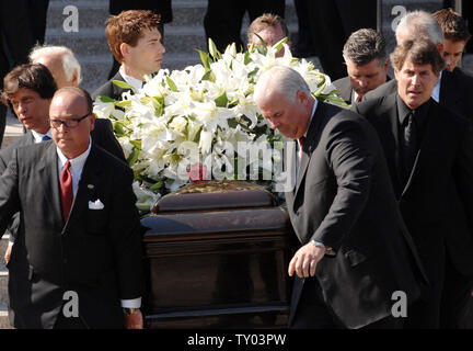 Pallbearers carry the casket containing the remains of former Supreme ...