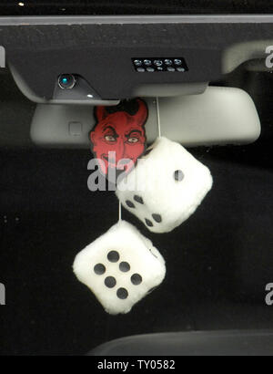 The car which transports defendant Phil Spector to a court appearance sports the face of a devil and a pair of fuzzy dice hanging from the rear view mirror in Los Angeles, California on September 19, 2007. The jury reported to the judge on Tuesday that they had reached a 7-5 impasse in Spector's murder trial. (UPI Photo/ Phil McCarten) Stock Photo