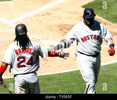 Boston Red Sox' Kevin Millar connects on an RBI single, his fourth RBI of  the game, during the second inning against the Tampa Bay Devil Rays at  Fenway Park in Boston Wednresday