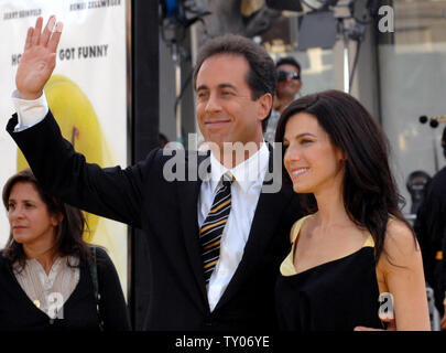 Cast member Jerry Seinfeld (L), who lends his voice to character Barry B. Benson in the animated motion picture 'Bee Movie,' arrives with his wife Jessica at the premiere of the film in Los Angeles on October 28, 2007. (UPI Photo/Jim Ruymen) Stock Photo