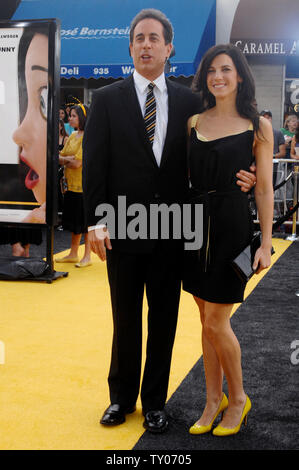 Cast member Jerry Seinfeld (L), who lends his voice to character Barry B. Benson in the animated motion picture 'Bee Movie,' arrives with his wife Jessica at the premiere of the film in Los Angeles on October 28, 2007. (UPI Photo/Jim Ruymen) Stock Photo