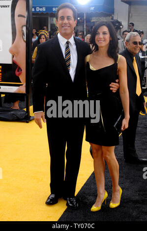 Cast member Jerry Seinfeld (L), who lends his voice to character Barry B. Benson in the animated motion picture 'Bee Movie,' arrives with his wife Jessica at the premiere of the film in Los Angeles on October 28, 2007. (UPI Photo/Jim Ruymen) Stock Photo