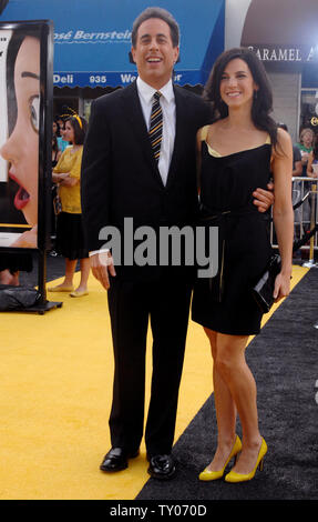 Cast member Jerry Seinfeld (L), who lends his voice to character Barry B. Benson in the animated motion picture 'Bee Movie,' arrives with his wife Jessica at the premiere of the film in Los Angeles on October 28, 2007. (UPI Photo/Jim Ruymen) Stock Photo