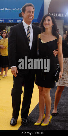 Cast member Jerry Seinfeld (L), who lends his voice to character Barry B. Benson in the animated motion picture 'Bee Movie,' arrives with his wife Jessica at the premiere of the film in Los Angeles on October 28, 2007. (UPI Photo/Jim Ruymen) Stock Photo