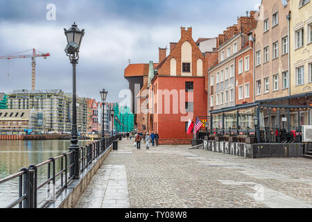 Gdansk, Poland – Feb 14, 2019: The classic view of Gdansk with the historic Gdansk Crane and the Hanseatic-style buildings along River Motlawa, Poland Stock Photo