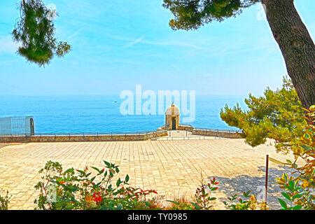 Monte-Carlo, Monaco - June 13, 2014: sea and seaside with southern coniferous trees Stock Photo