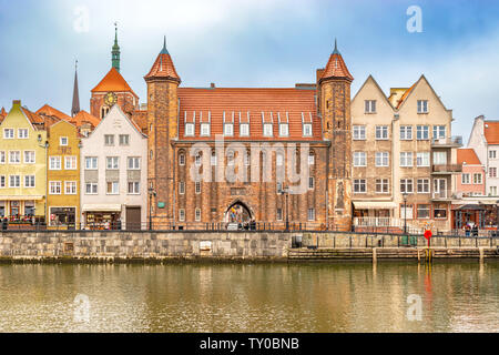 Gdansk, Poland – Feb 14, 2019: View at historic houses and the Mariacka Gate building facade along Motlawa river in Gdansk, Poland Stock Photo