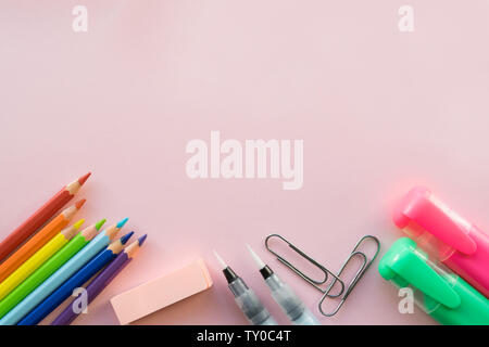 Office supplies on pink background. Free space Stock Photo