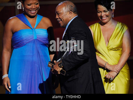 Actress Queen Latifah and BET Holdings president Debra Lee (R) congratulate composer and record producer Quincy Jones accepts the Humanitarian Award during the BET Awards at the Shrine Auditorium in Los Angeles on June 24, 2008.  (UPI Photo/Jim Ruymen) Stock Photo