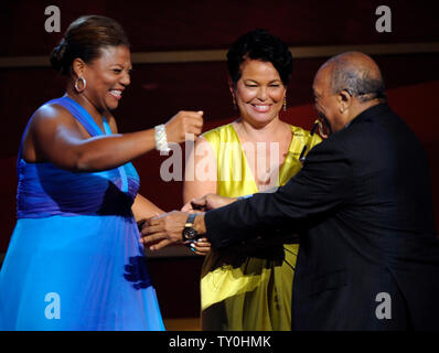 Actress Queen Latifah and BET Holdings president Debra Lee (C) congratulate composer and record producer Quincy Jones accepts the Humanitarian Award during the BET Awards at the Shrine Auditorium in Los Angeles on June 24, 2008.  (UPI Photo/Jim Ruymen) Stock Photo