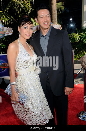 Russell Wong, a cast member in the motion picture fantasy thriller 'The Mummy: Tomb of the Dragon Emperor', attends the premiere of the film with his wife Flora Cheung in Los Angeles on July 27, 2008.  (UPI Photo/Jim Ruymen) Stock Photo