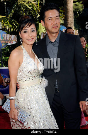 Russell Wong, a cast member in the motion picture fantasy thriller 'The Mummy: Tomb of the Dragon Emperor', attends the premiere of the film with his wife Flora Cheung in Los Angeles on July 27, 2008.  (UPI Photo/Jim Ruymen) Stock Photo