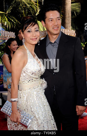 Russell Wong, a cast member in the motion picture fantasy thriller 'The Mummy: Tomb of the Dragon Emperor', attends the premiere of the film with his wife Flora Cheung in Los Angeles on July 27, 2008.  (UPI Photo/Jim Ruymen) Stock Photo