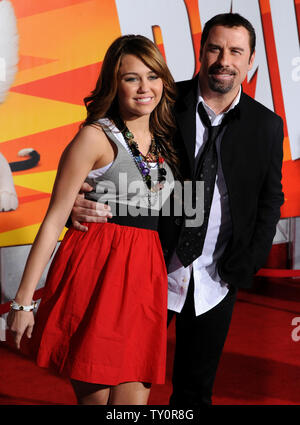 Actress and singer Miley Cyrus (L) and actor John Travolta, who provide voice work in the animated film 'Bolt', attend the premiere of the film at the El Capitan Theatre in the Hollywood section of Los Angeles on November 17, 2008. (UPI/Photo/Jim Ruymen) Stock Photo